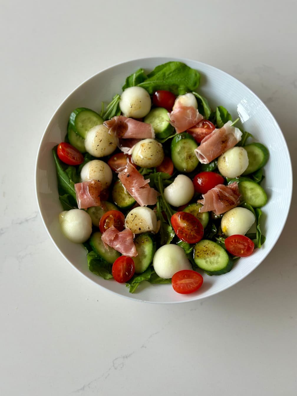 Ensalada de rúgala baby, melón y prosciutto